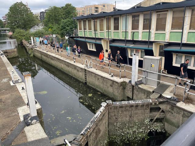 The locks in Brentford with walkers from a distance
